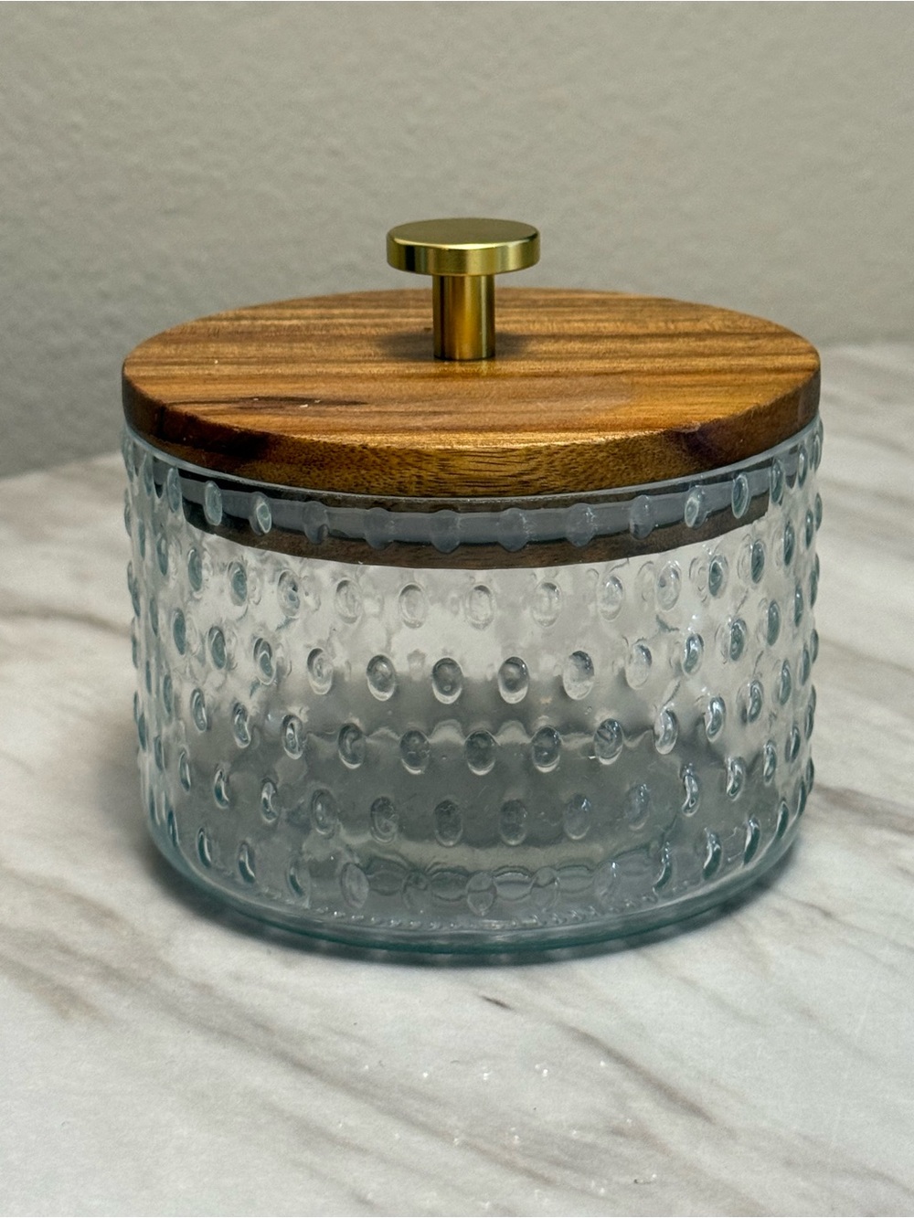 Round clear jar with wooden top gold finish handle